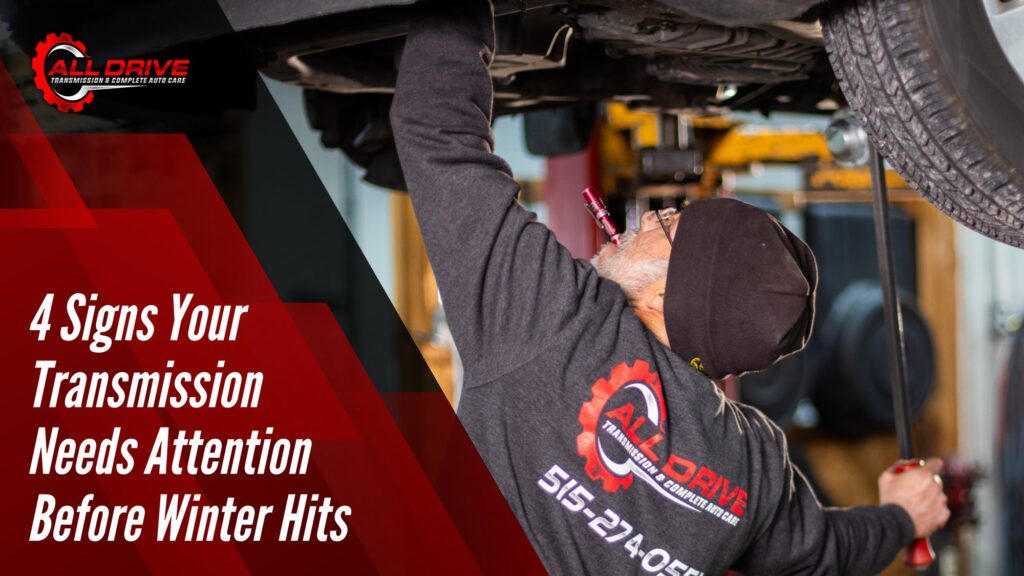 All Drive technician inspecting a vehicle transmission on a lift before winter